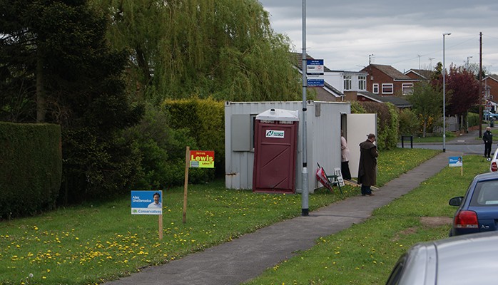 People voting in a pop-up polling booth