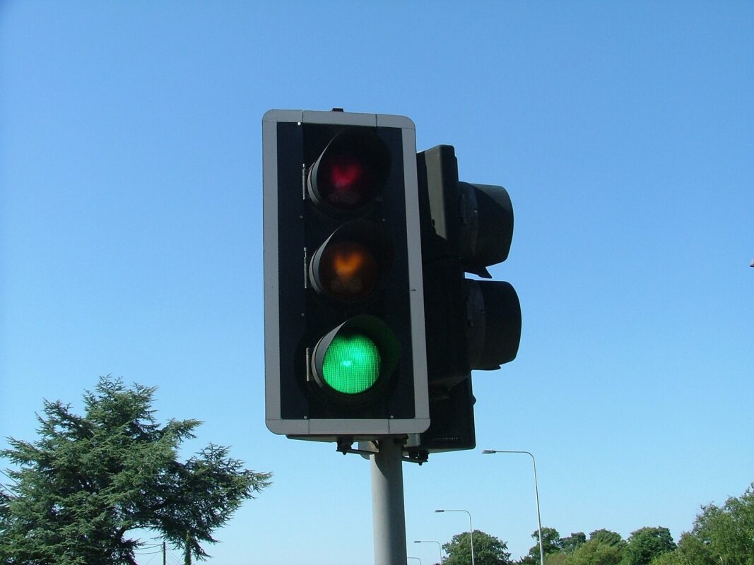 A photograph of a traffic light showing green for 'go'