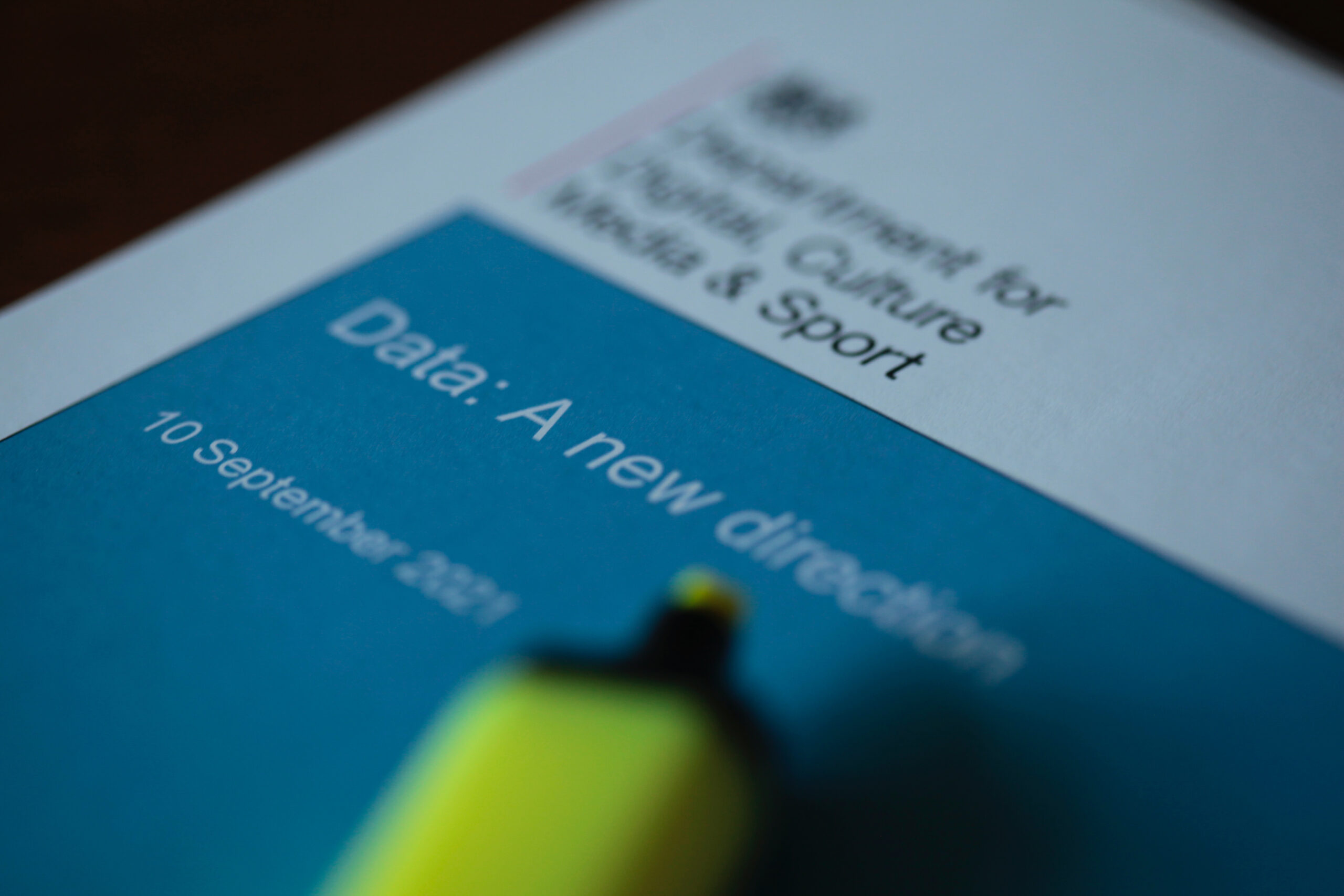 A photo of the Data: a new direction consultation document with a yellow highlighter pen resting on the cover