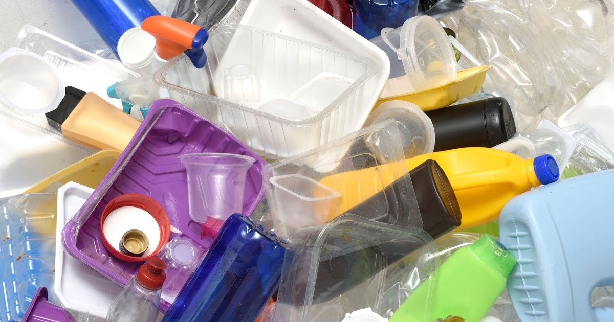 A pile of different plastics including food trays and bottles.