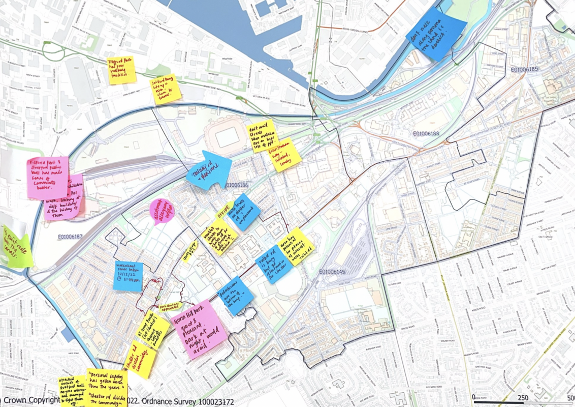 A map of Trafford covered in post-it notes of different colours.