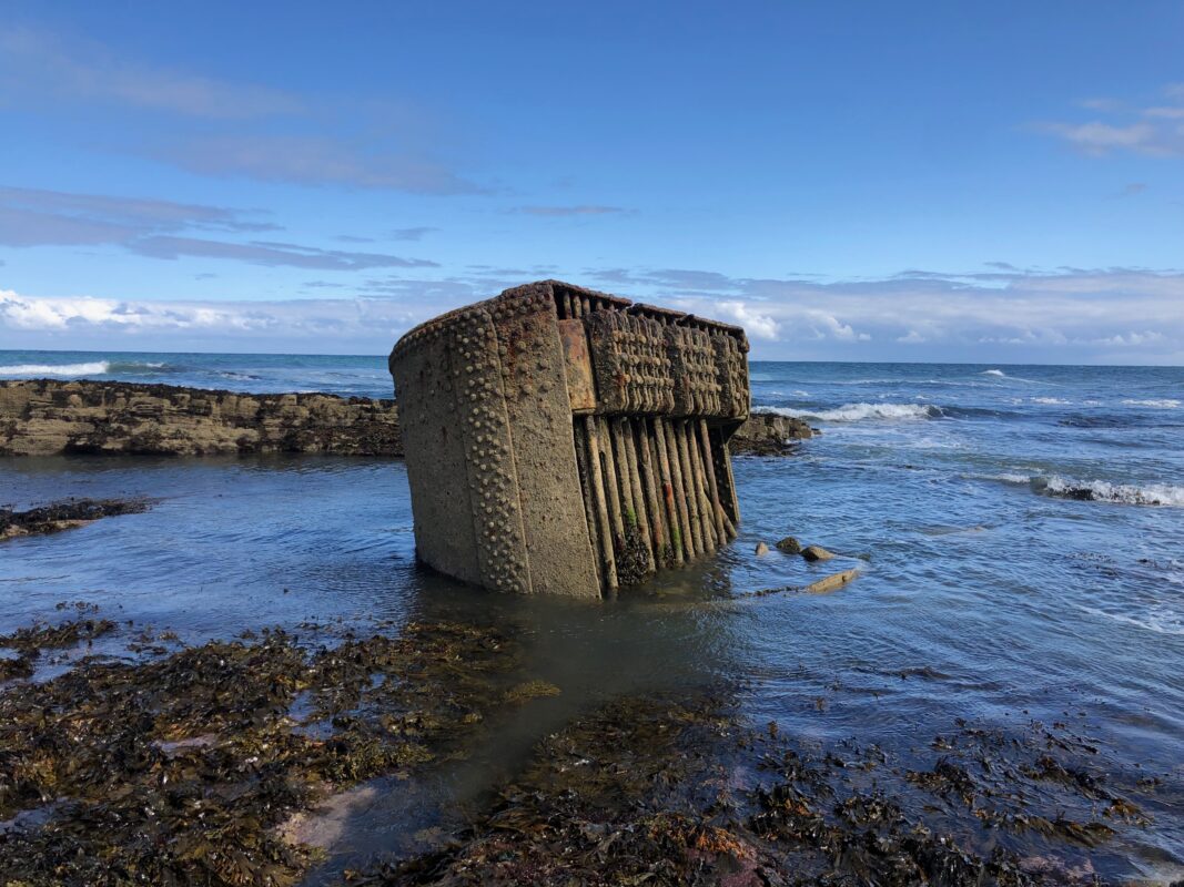 Shipwrecked boiler that has been corroded after over a century of weathering.