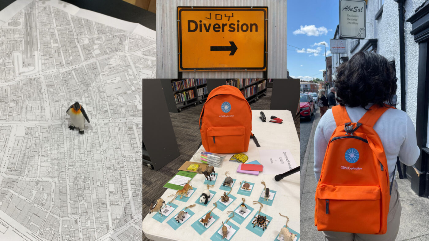 Composite image showing an Emperor Penguin model on an old map of Liverpool, a diversion road sign with Joy graffitied at the top. A table with plastic animal models in front of an orange back pack and someone walking along with an orange backpack photographed from behind