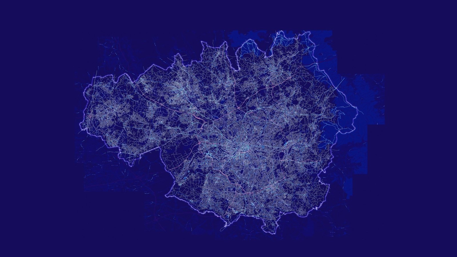 Line drawn map of the transport network of Greater Manchester off white against blue. Source material Open Street Map